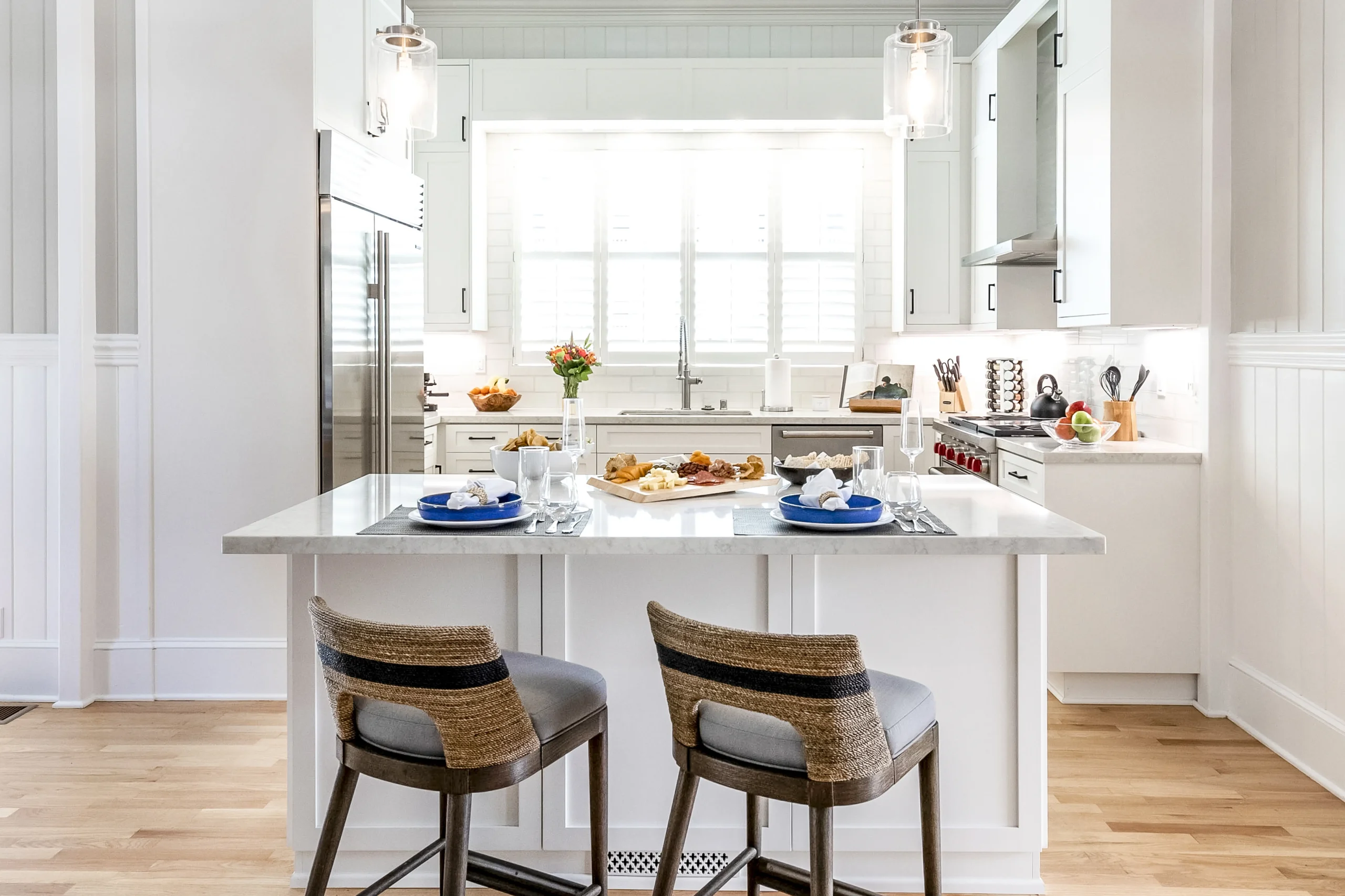 kitchen island with bar stools and placesettings
