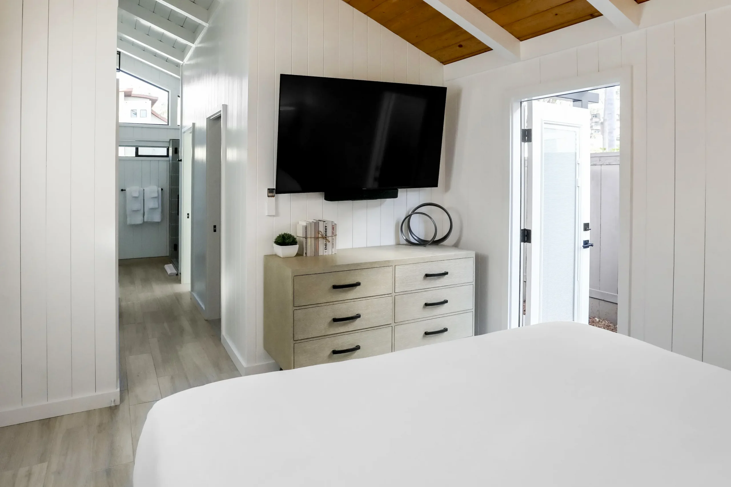 guestroom with view of TV and storage