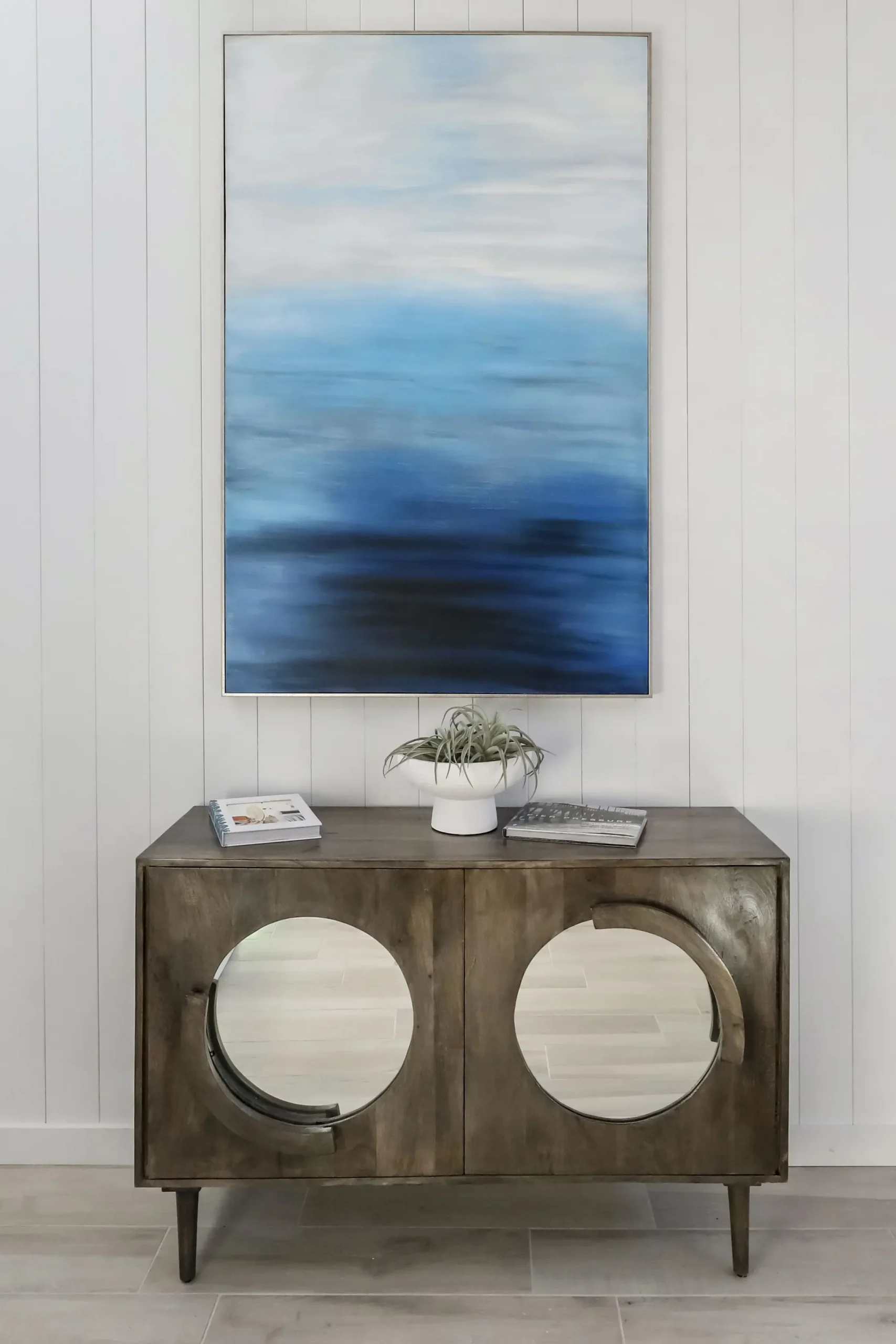 wood credenza with ocean atrwork and Del Mar beach look book